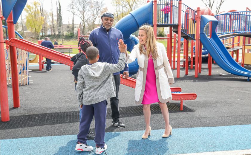 Laura at a play ground with people